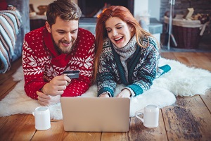 Young Couple Online Shopping During the Holiday Season